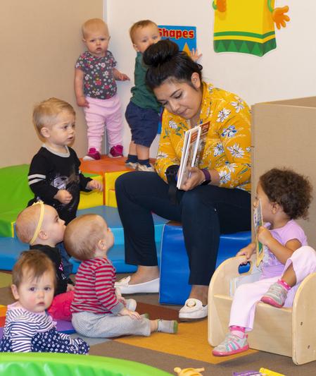image_12 Staff reading book to students